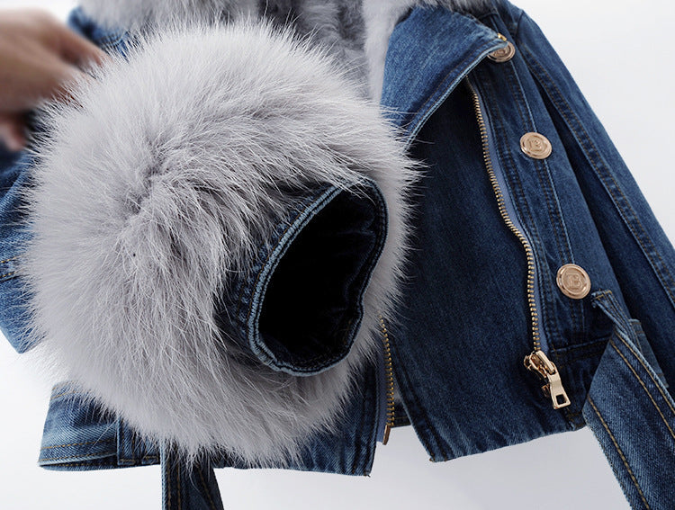 Blue denim jacket with a fluffy white hood on a white background