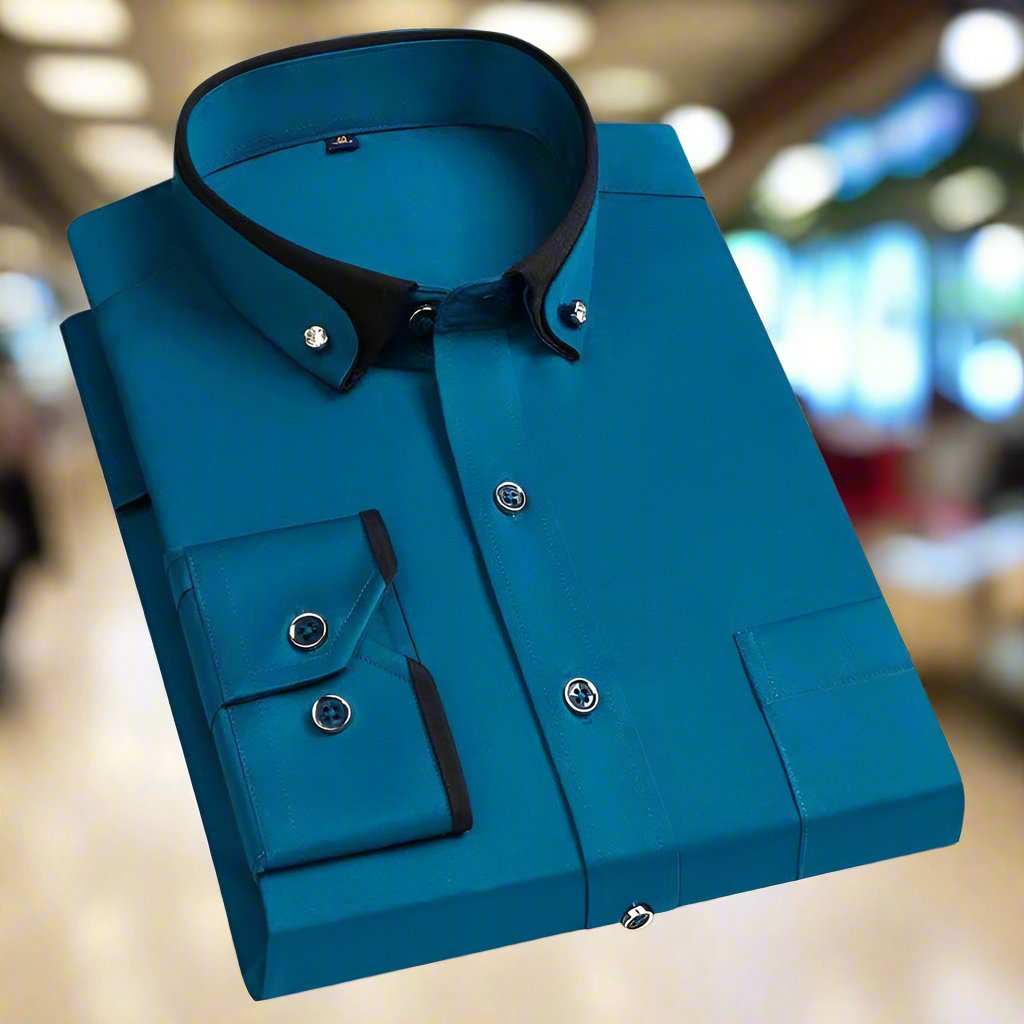 Blue shirt with black collar on a blurred indoor background