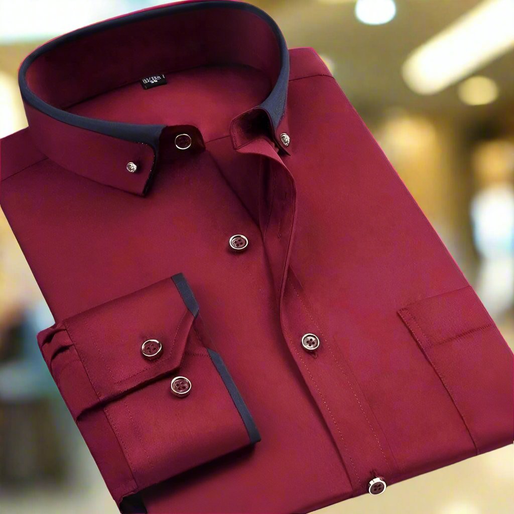 Red dress shirt with black trim on a blurred indoor background