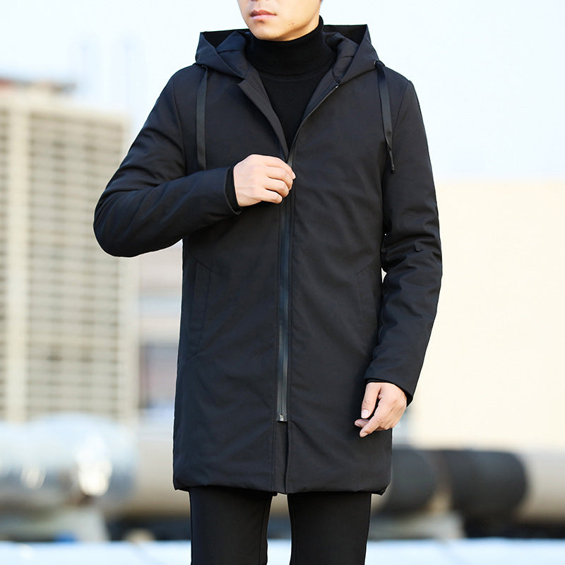 Person wearing a black coat with a blurred background
