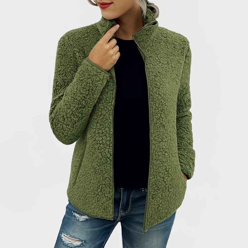 Green fleece jacket worn by a person on a white background