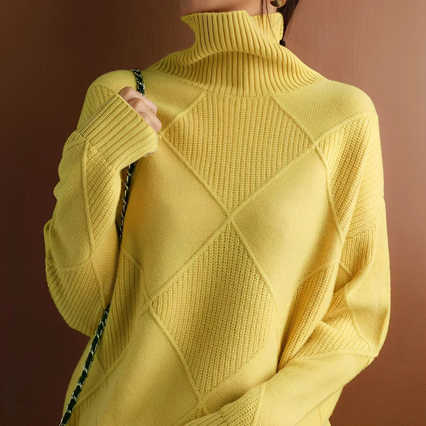 Person wearing a yellow turtleneck sweater with dark pants