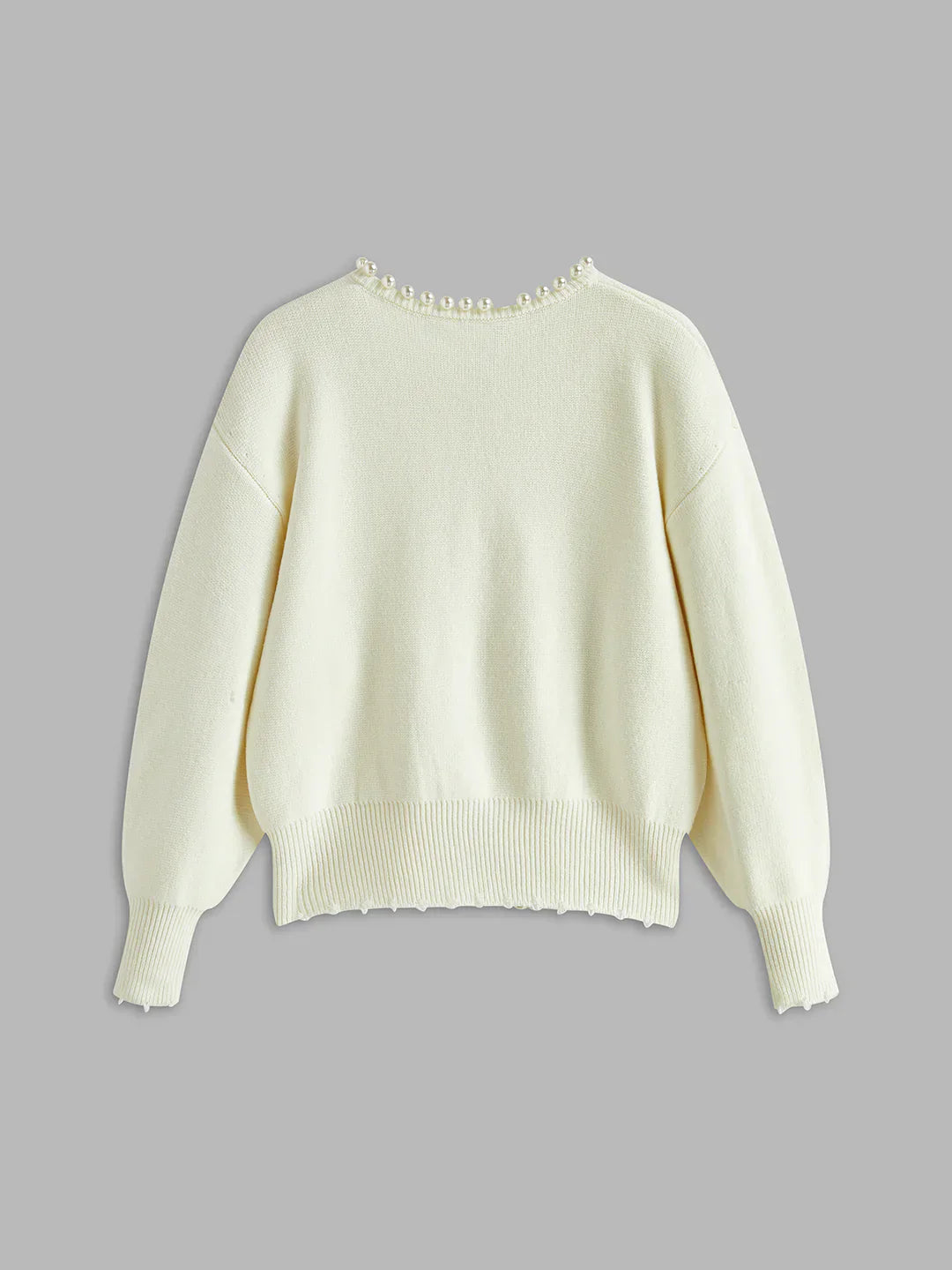 White sweater on a gray background