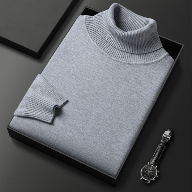Folded dark green turtleneck sweater displayed with a watch.