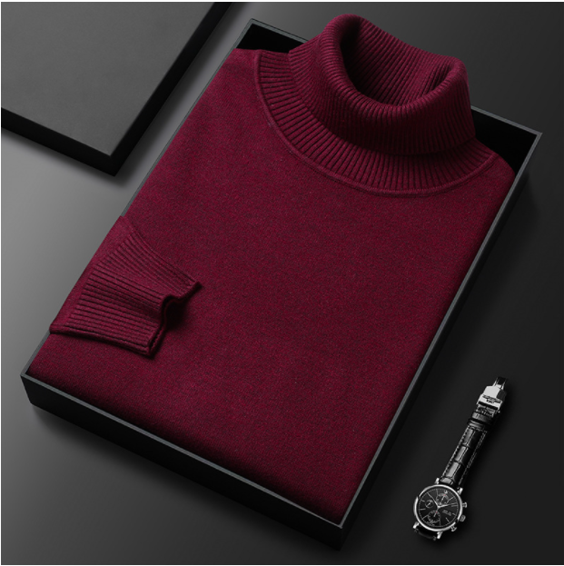 Folded beige turtleneck sweater displayed with a watch.