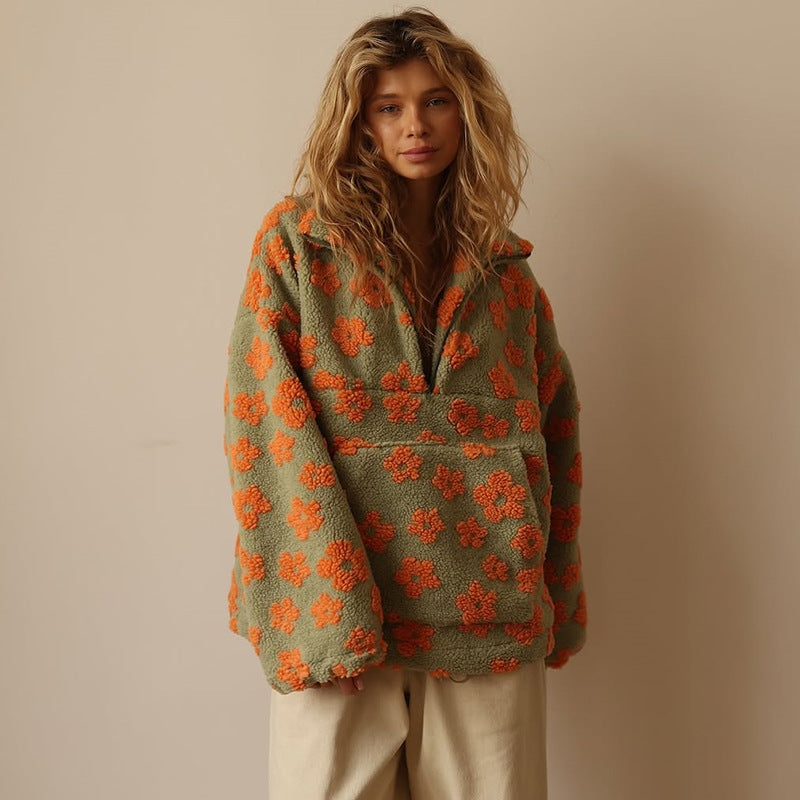 Woman wearing a green and orange floral-patterned jacket against a beige background