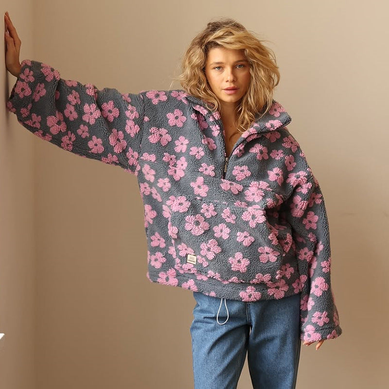 Woman wearing a floral patterned jacket against a beige background