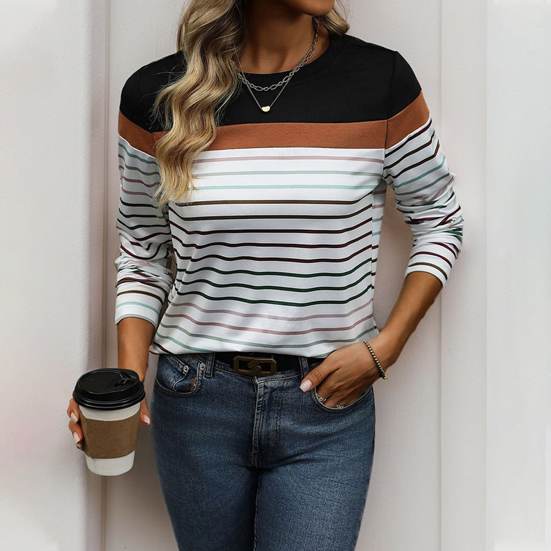 Woman wearing a black and brown striped shirt with a white background