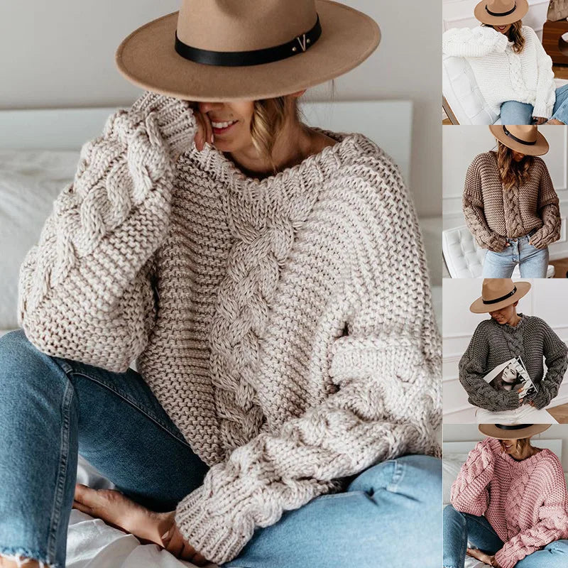 Woman wearing a chunky knit sweater and wide-brimmed hat, sitting on a couch.