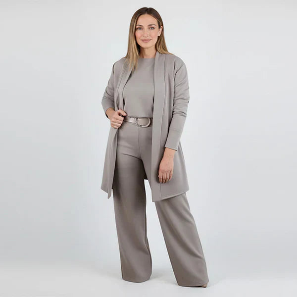 Woman wearing a gray suit on a white background