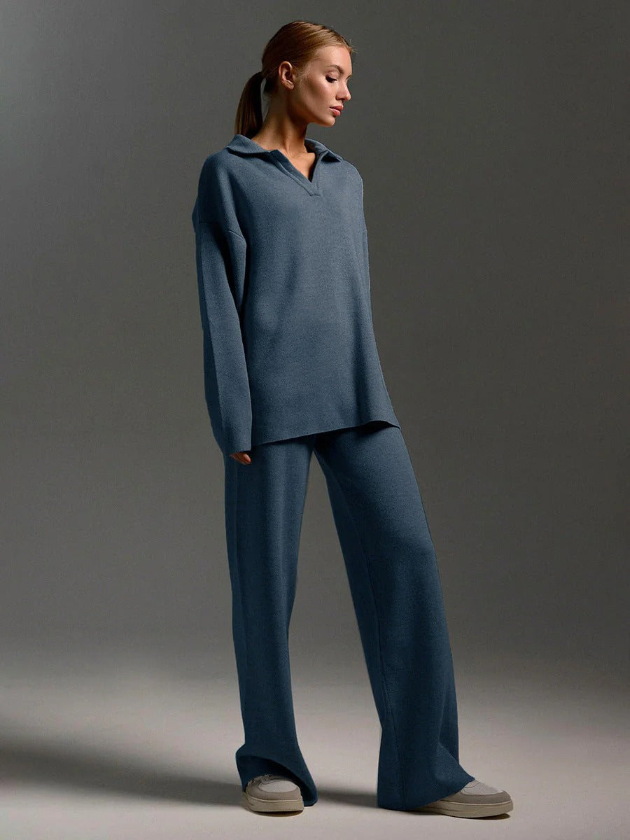 Woman wearing a blue outfit against a gray background