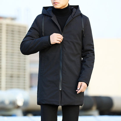 Person wearing a black coat with a blurred background