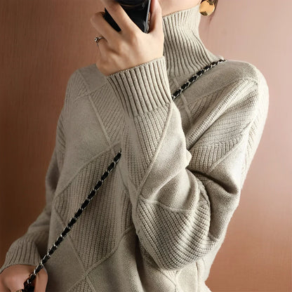 Person wearing a turtleneck sweater with dark pants