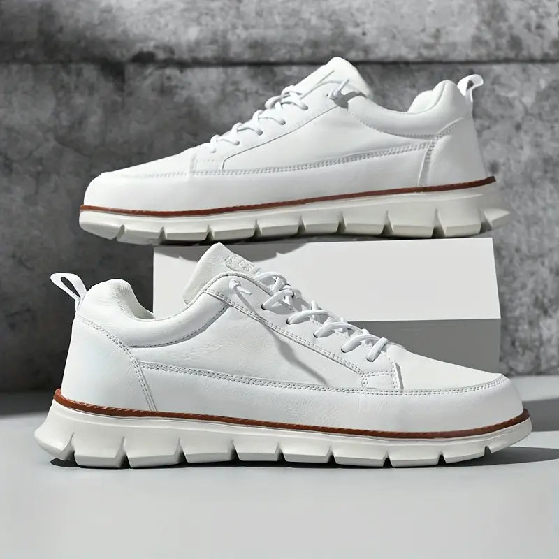 White sneakers with thick soles on a gray background