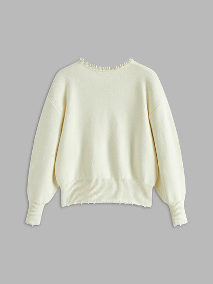 White sweater on a gray background