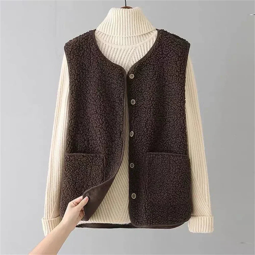 Brown fleece vest on a mannequin with a gray background