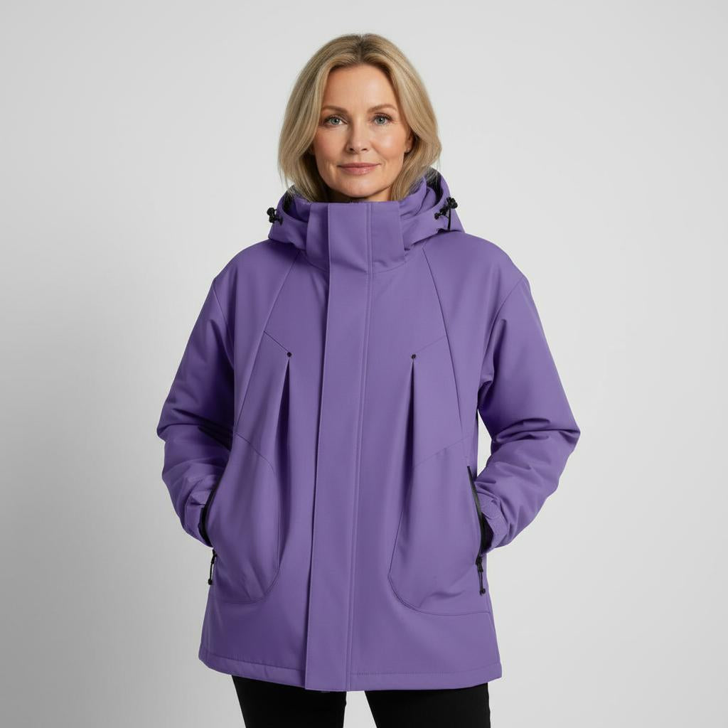 Woman wearing a purple jacket on a gray background