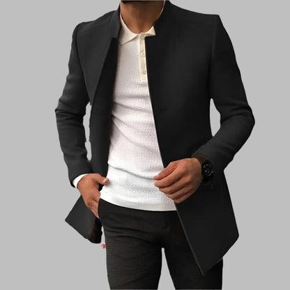 Black blazer over a white shirt on a gray background