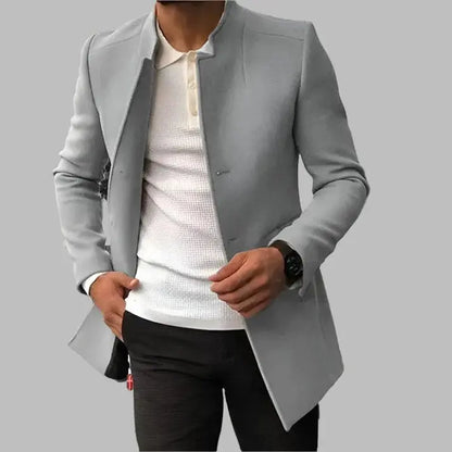 Gray blazer over a white shirt and black pants on a gray background