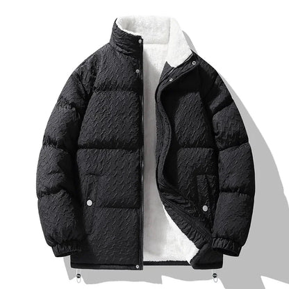Black puffer jacket on a white background