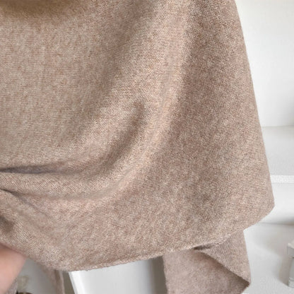 Close-up of a textured beige fabric on a white background