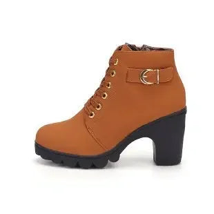 Brown ankle boot with black sole on a white background