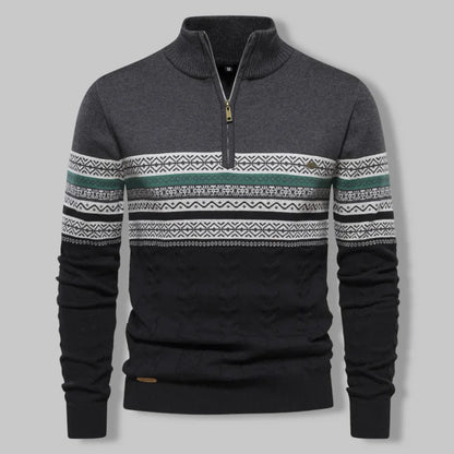 Gray sweater with patterned sleeves on a gray background