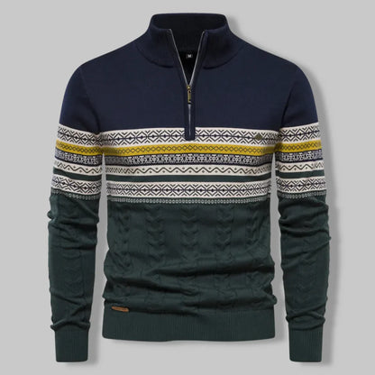 Navy sweater with patterned sleeves on a gray background