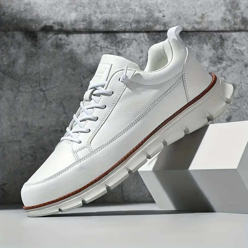 White sneakers with brown accents on a gray background