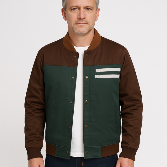 Man wearing a brown and green jacket with a white shirt underneath on a light gray background